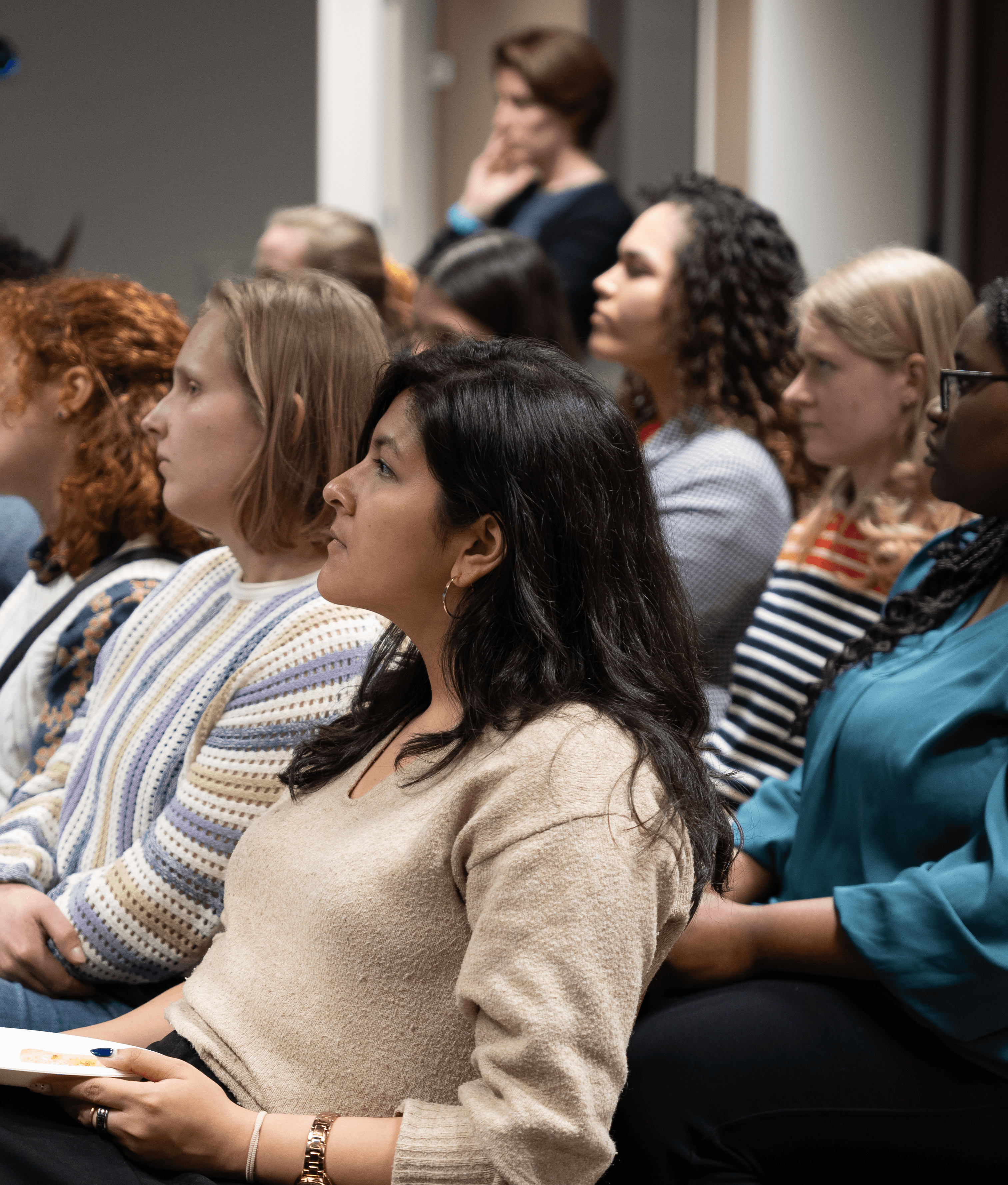 Women looking at woman speaking